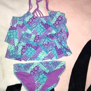 A Justice white, blue and purple swimsuit